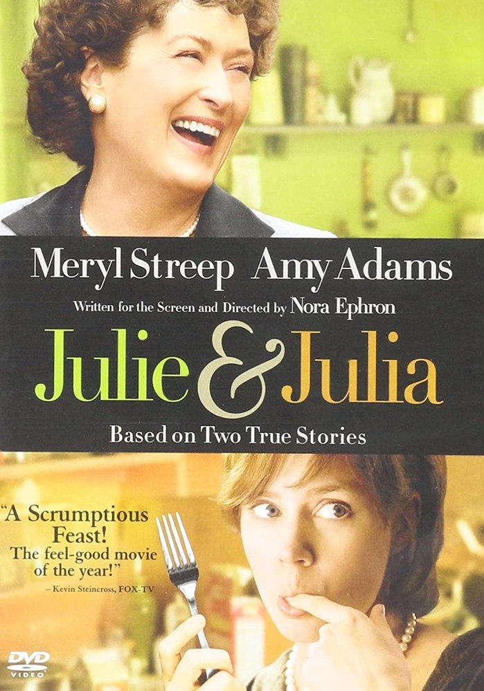 The DVD cover for the movie with Meryl Streep as Julia Child at the top in a green kitchen and Amy Adams licking her finger and holding a fork at the bottom.