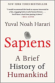 A beige cover features a smudged fingerprint dotting the "i" in Sapiens.