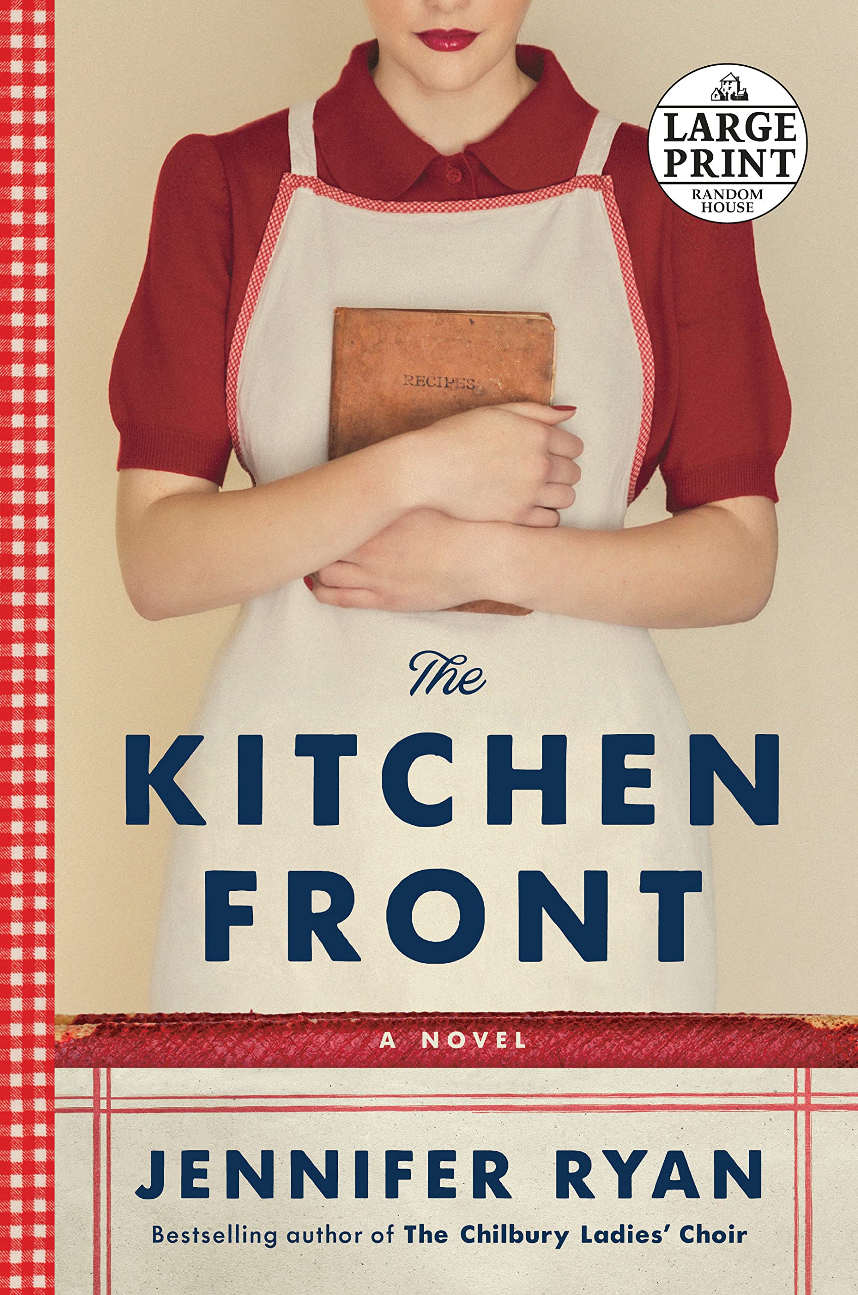 Image of a woman in a red shirt, red lipstick, and a white apron holding a cookbook across her chest. Red gingham boarder